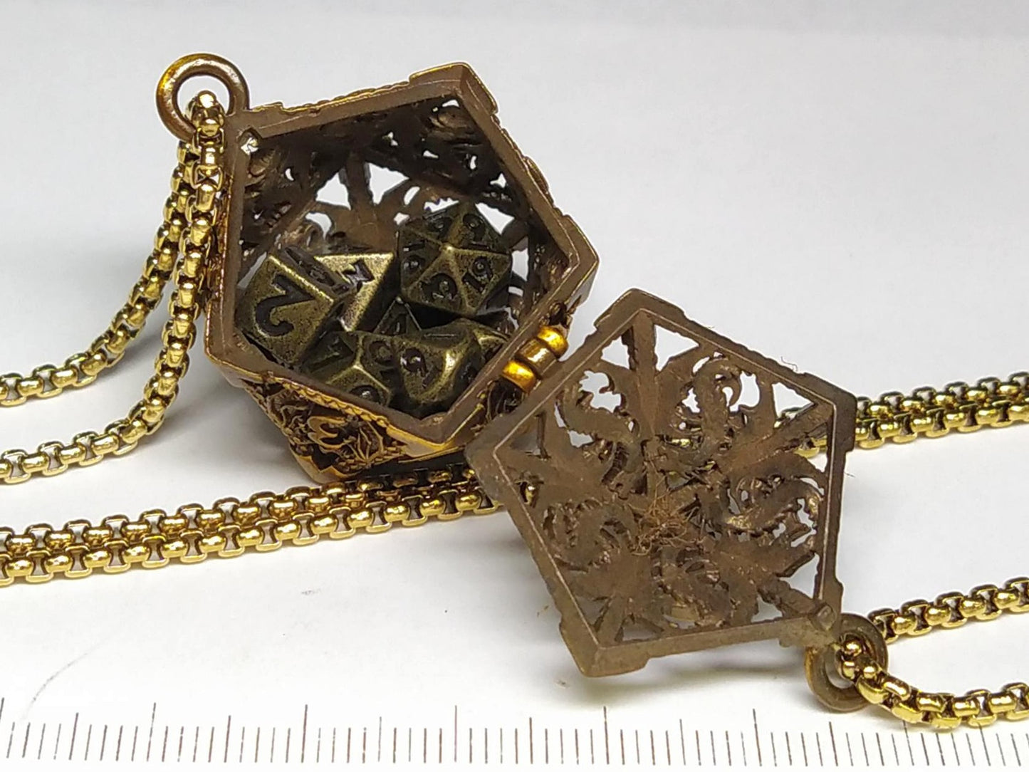 Gold Hollow Dragon dice cage pendant, with mini metal dice